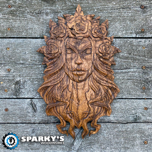 Hand finished and stained cherry wood wall art featuring a precision carved Santa Muerte with floral crown, handcrafted in USA for unique decor and gifts.