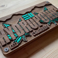 Hand stained walnut wood license plate with precision carved "Hydroponic" design accented in green, handcrafted in USA for unique wood decor and gifts.